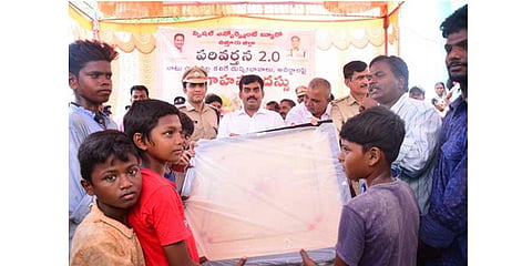 SEB JD Avula Ramesh Reddy and Chittoor SP Y Rishanth Reddy participated in the Operation Parivartana programme at Chinna and Pedda Harijanawada villages in Karvetinagaram on Sunday. (Express Photo)