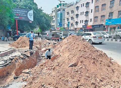 Heaps of earth near a dug-up road at Rajinder Nagar on Tuesday (Photo| Express)
