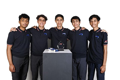 Amod and Adithya with team members.