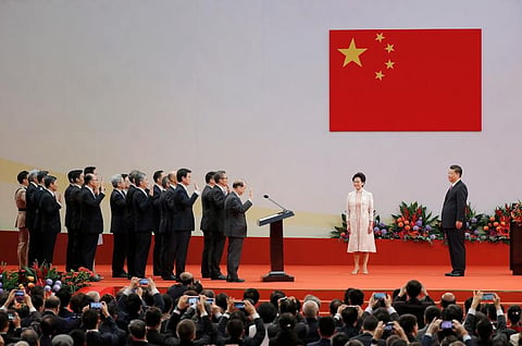 Chinese President Xi Jinping(R) administers the oath to Hong Kong's new Chief Executive Carrie Lam's new cabinet. (Photo | AP)