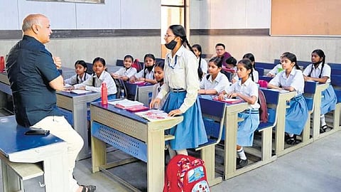 Image of Manish Sisodia interacting with students used for representational purposes