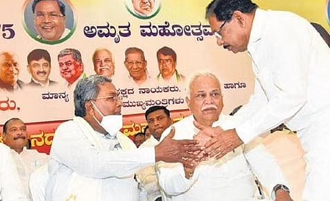 CLP leader Siddaramaiah greets former DyCM Dr G Parameshwara at the Siddaramotsava preparatory meeting in Bengaluru on Wednesday