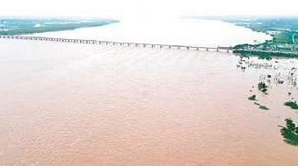 Godavari river flows at the 70.3 ft mark in Bhadrachalam on Friday.