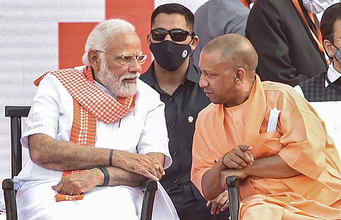 Prime Minister Narendra Modi with BJP leader Yogi Aditiyanath. (Photo | PTI)