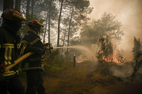 In France, heat records were broken and swirling hot winds complicated firefighting in the country's southwest. (Photo | AP)