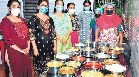 Beneficiaries of community kitchen in Balusserry with the cook Asya V P (extreme right)