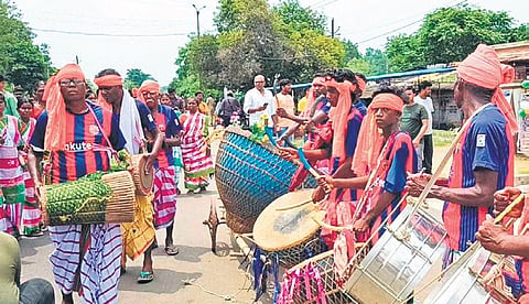 Tribals celebrate by beating drums in front of Droupadi Murmu's house in Mayurbhanj. (Photo| EPS)