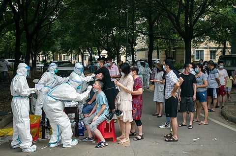 Residents line up to be tested for COVID-19 in Wuhan, central China's Hubei province on August 3, 2021. (File Photo | AP)