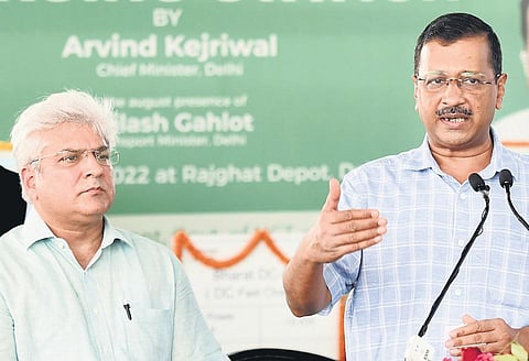CM Arvind Kejriwal with Transport Minister Kailash Gahlot during the inauguration of EV charging stations on Wednesday. (Photo | Parveen Negi)