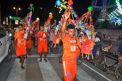 Kanwariyas raise slogans during the 'Kanwar Yatra'