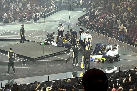 Two dancers receive medical treatment at a concert of Cantopop boy band Mirror, in Hong Kong. (Photo | AP)