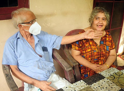 Kamalasan with his daughter Priya at their house in Kozhikode. (Photo | E Gokul, EPS)
