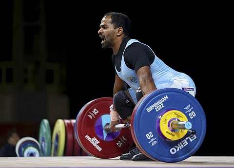 India's Gururaja in action during the Mens 61kg weightlifting at The NEC on day two of the Commonwealth Games in Birmingham. (Photo | AP)