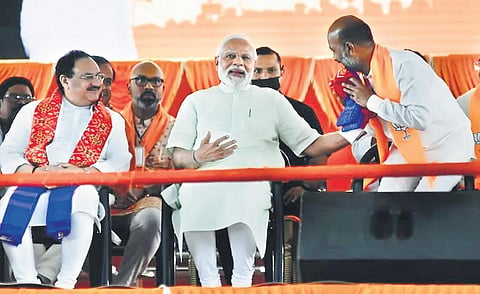 Prime Minister Narendra Modi pats BJP State president Bandi Sanjay Kumar during Vijaya Sankalpa Sabha at Parade Grounds in Secunderabad on Sunday | Vinay Madapu
