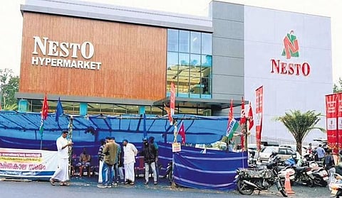 The strike by joint trade unions in front of Nesto hypermarket in Kalpetta