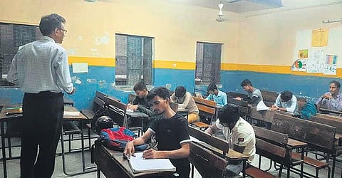 A special coaching session being held for CUET aspirants at the Government Boys  Senior Secondary School in Shahdara. (Photo | Express)