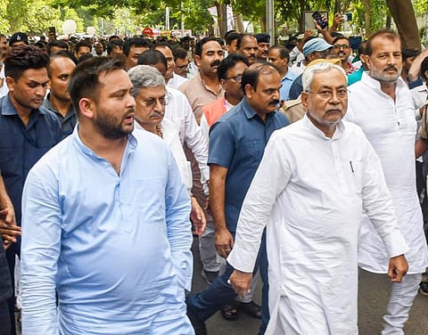 Janata Dal (United) leader Nitish Kumar with JDU National President Lalan Singh and Rashtriya Janata Dal leader Tejashwi Yadav, in Patna. (File Photo | PTI)