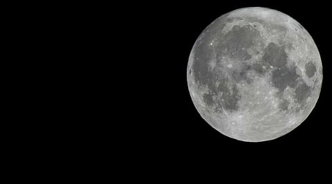 The moon rises over Antwerp, Belgium. (Photo| AP)