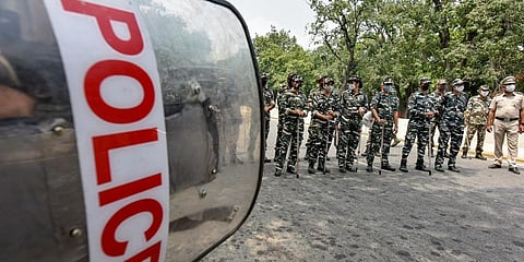 Security personnel stand guard during a protest by BJP members against vandalisation of Maharaja Ranjit Singh's statue in Lahore, outside Pakistan High Commission, in Delhi, Aug 2021. (Photo | PTI)
