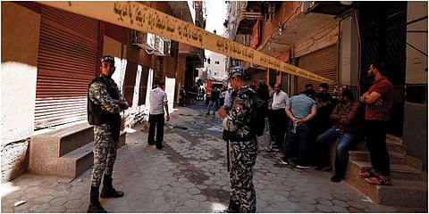 Egyptian police gather outside the Abu Sifin church on August 14, 2022, after more than 40 people were killed when a fire ripped through a Coptic Christian church during Sunday mass. (Photo | AFP)