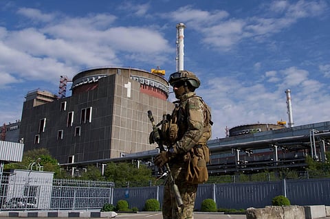 A Russian serviceman on patrol near Ukraine's Zaporizhzhia nuclear power plant. (Photo | AFP)