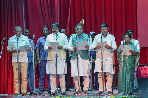 Bihar Governor Phagu Chauhan (unseen) administers the oath of office to Mohd Zama Khan and Jayant Raj (JDU), Jitendra Kumar Rai, Anita Devi and Sudhakar Singh (RJD) during a swearing-in. (Photo | PTI)
