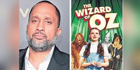 Kenya Barris and the poster of  The Wizard of Oz