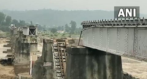 The railway bridge on Chakki river in Himachal Pradesh's Kangra district damaged due to flash flood, and collapsed. (Photo | Special Arrangement, ANI)