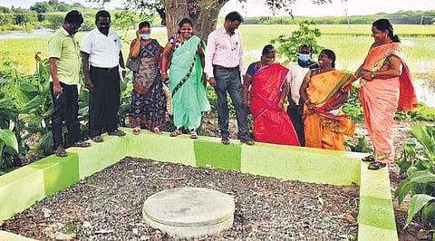 Officials and gram panchayat members inspect the soak pits at Ariyanendal panchayat in Ramanathapuram district | Express