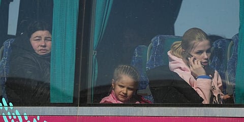 (Representational Image). Refugees look out from a bus after fleeing the war from neighbouring Ukraine, at the border crossing in Palanca, Moldova.