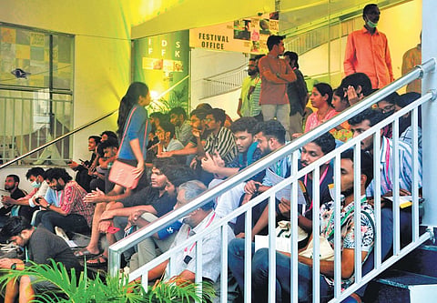 Delegates of the 14th International Documentary and Short Film Festival of Kerala spending their leisure time on the steps of Kairali-Sree-Nila theatre in Thiruvananthapuram, the venue of the festival
