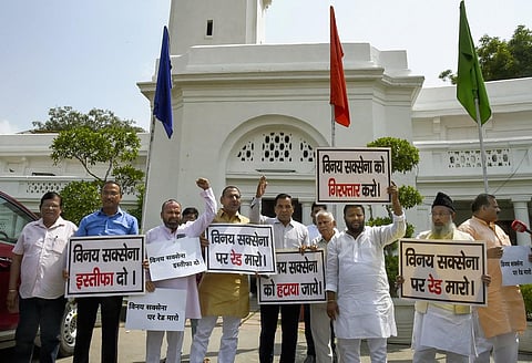 AAP MLAs raise slogans during a protest against Delhi Lt Governor Vinai Saxena at Delhi Legislative Assembly complex, in New Delhi, Tuesday. (Photo | PTI)