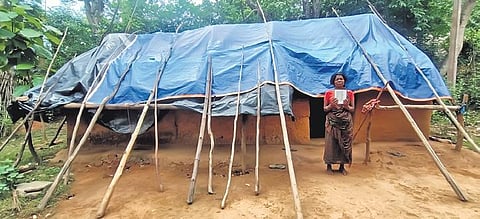 Chandamoni of Govindchandrapur in front of her tarpaulin covered house  | Express