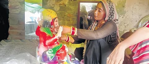 An artisan giving a final touch to Lord Ganesha’s idol ahead of the festival | Express