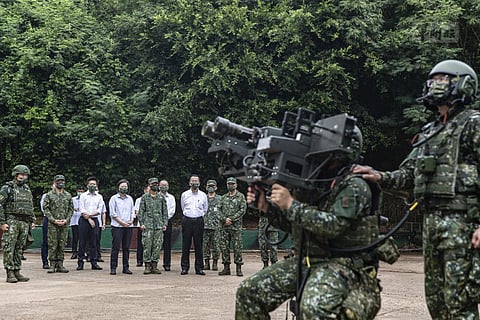 Taiwan's President Tsai Ing-wen watches soldiers operate equipment during a visit to a naval station on Penghu. (Photo | AP)