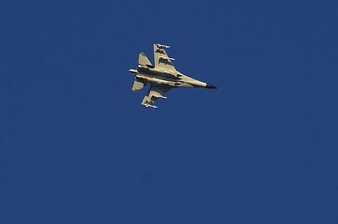 A military fighter jet flies above the Taiwan Strait as seen from the 68-nautical-mile scenic spot, the closest point in mainland China to the island of Taiwan. (Photo | AP)