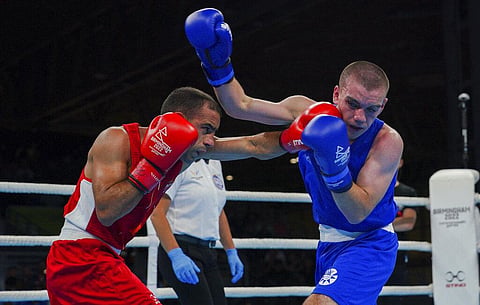 India's Amit Panghal, left, and Scotland's Lennon Mulligan in the Men's Fly (48-51kg) quarterfinal during the Commonwealth Games. (Photo | AP)