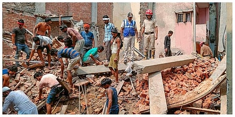 Rescue operation underway after a four-storey under-construction building collapsed in the Azad Market area. (Photo |PTI)