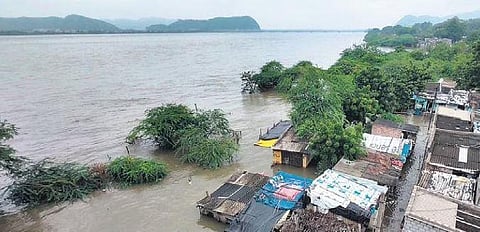 Low-lying areas on the banks of River Krishna inundated as surplus floodwater released downstream Prakasam Barrage in Vijayawada | Prasant Madugula