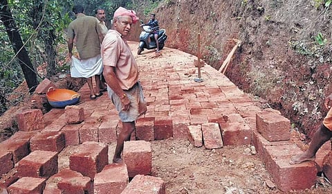 A road at Paivalike grama panchayat in Kasaragod being paved with laterite stone