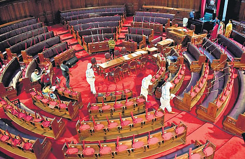 Healthcare workers sanitise the West Bengal Assembly House. (File photo| Bibhash Lodh, EPS)