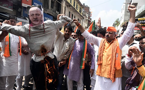 Delhi BJP chief Adesh Gupta leads a stir outside Deputy CM Manish Sisodia’s residence, following a CBI raid on August 25 | Parveen Negi
