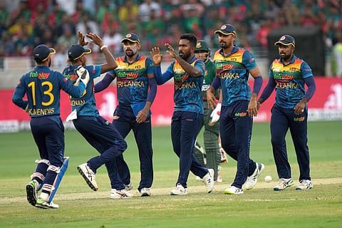 Sri Lanka's Asitha Fernando, center, celebrates with teammates after taking the wicket of Bangladesh's Sabbir Rahman during the T20 cricket match of Asia Cup.  (Photo | PTI)