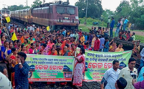 Agitators from the Kurmi community block railway tracks to press for their demand for Scheduled Tribe (ST) status, in Mayurbhanj district on September 20, 2022. (Photo | PTI)