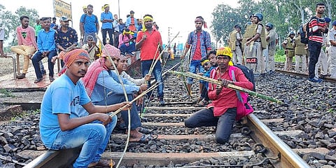 Agitators from the Kurmi community block railway tracks to press for their demand for Scheduled Tribe (ST) status, in West Medinipur. (Photo | PTI)