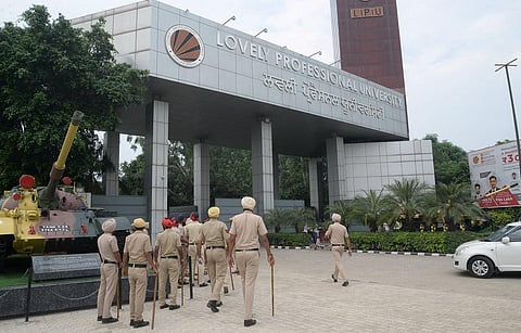 Police personnel keep vigil outside Lovely Professional University, after protests erupted on Tuesday night in Jalandhar  on Wednesday. (Photo | PTI)