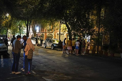 People gather outside after an earthquake was felt in Mexico Cit. (Photo | AP)