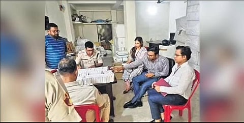 Cuttack Police carrying out verification during the raid on Monday | Express
