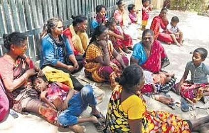 Residents sitting outside a building at Saidapet after having been evicted from Kavangarai | R Satish Babu