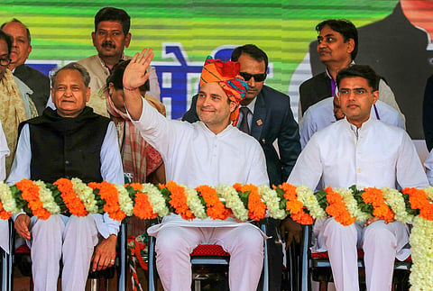 Congress party's Jaipur jeopardy: In this file image Rahul Gandhi waves to the crowd as Ashok Gehlot and  Sachin Pilot looks on during a rally. (Photo | PTI)